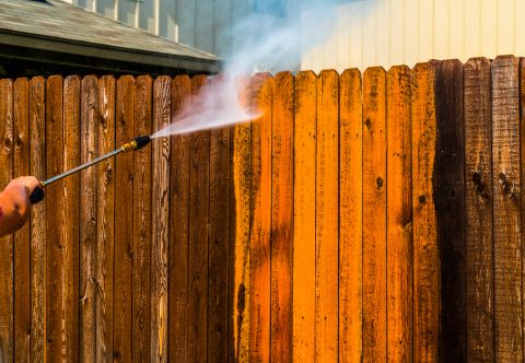 Pressure washing wooden fence