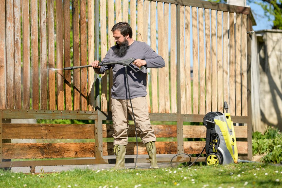 Pressure washing wooden fence